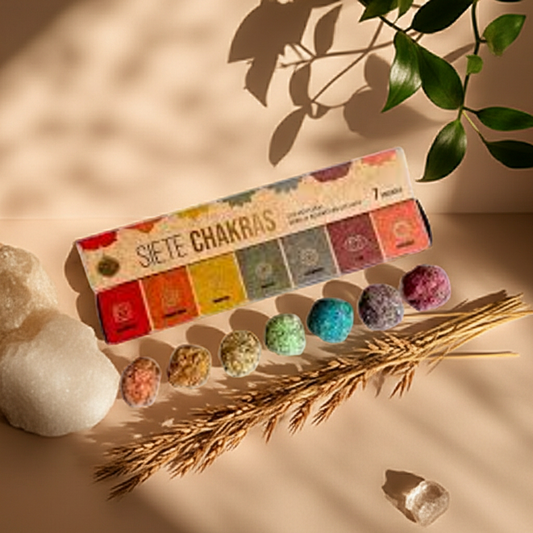 Bombitas de Defumación 7 Chakras sobre mesa natural, con cristales y decoración ritual en luz cálida.